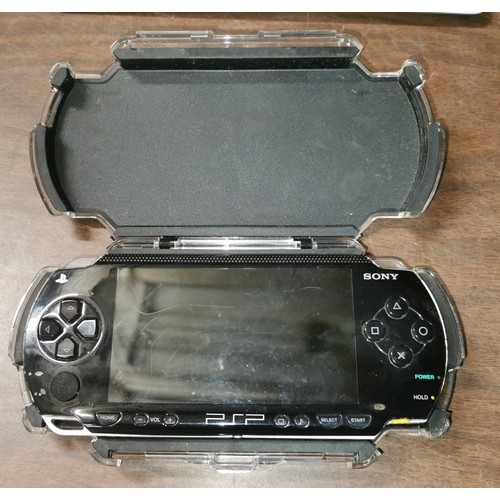 16 - Sony PSP-1003, scratches on screen, in protector - no power supply so untested