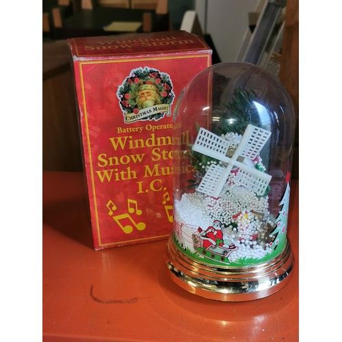 124 - Boxed 18.5 cm tall battery-operated musical windmill snow dome