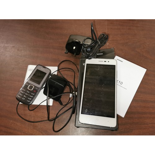 16 - Boxed Dodgee X10 smart phone and Nokia C1 mobile phone - both with scratches on screen