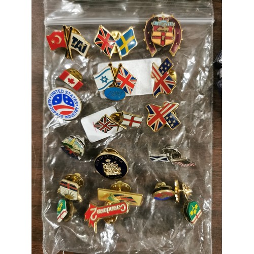 38 - Bundle of assorted bangles, earrings, badges and other nick nacks including some broken silver
