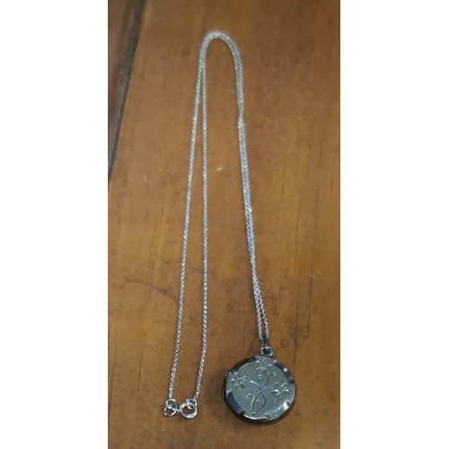 10 - Silver stamped locket on 18