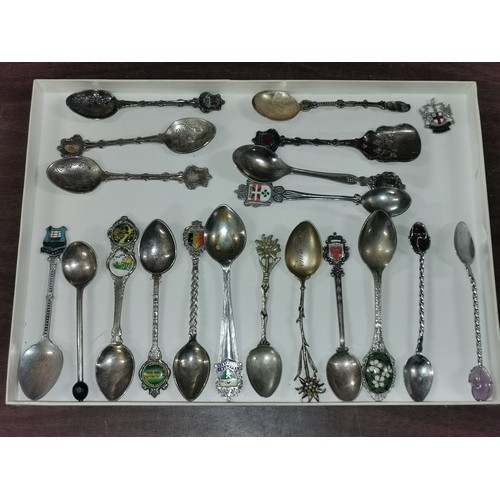 124 - Tray of assorted silver plate and pewter souvenir spoons