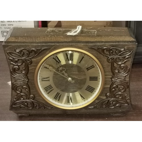 278 - 24 x 8 x 18 cm carved, wooden cased 'Becha' mantle clock