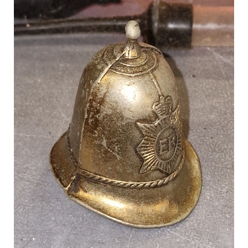 29 - 6 cm white metal bell shaped as policeman's helmet