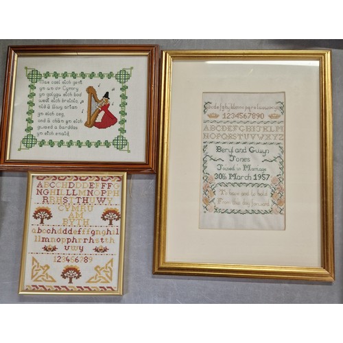 209 - 36.5 x 49.5 cm gilt framed and mounted sampler (1957 wedding gift), framed Welsh script needlework a... 