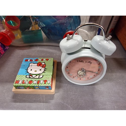 173 - Hello Kitty quartz alarm clock and wooden block puzzle - kindly donated with all proceeds from this ... 