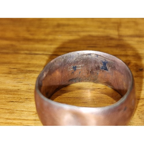 27 - Thick 9 ct gold band ring with dents and what looks like re-sizing