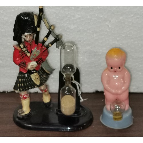 273 - Vintage Scottish souvenir plastic piper egg timer & other child urinating plastic figure