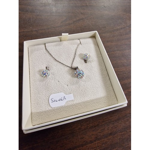 147 - Silver necklace and earrings set being crystal globe balls, all proceeds from this lot going to NSPC... 