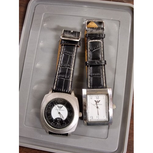 140 - 2 x gents designer style watches, both need batteries