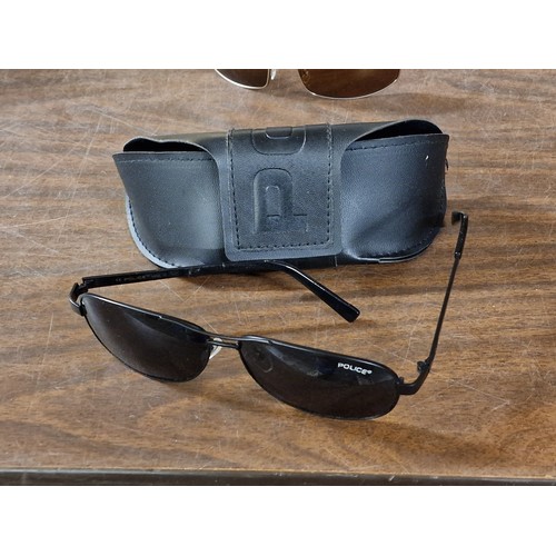 4 - Police designer sunglasses in case