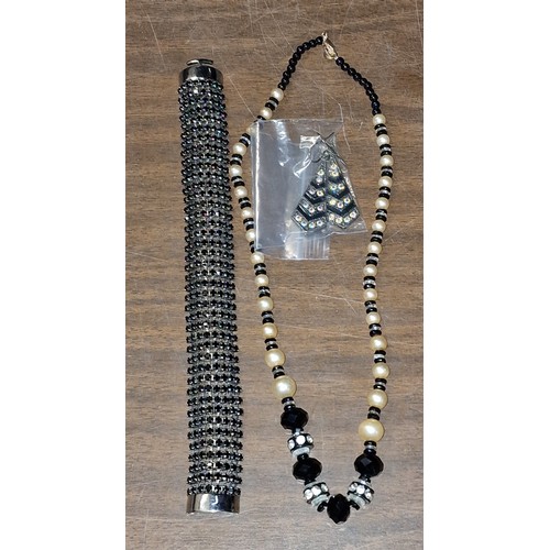 141 - Black glass and pearl, necklace, earrings and bracelet