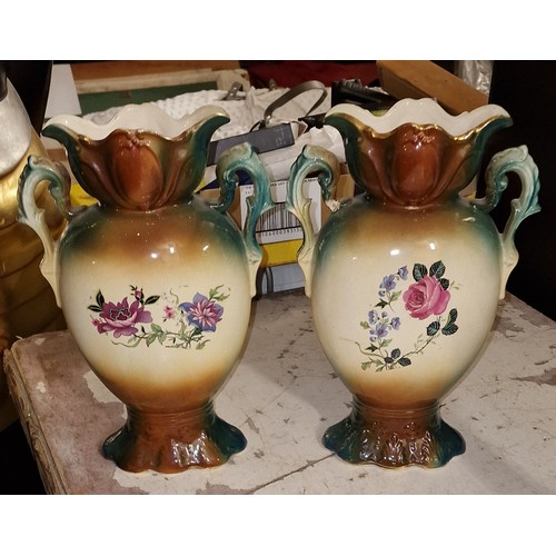 153 - Pair of 30 cm tall, twin handle garniture vases