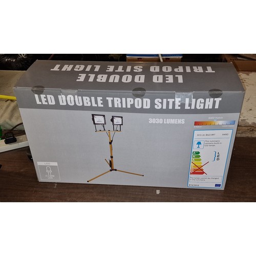 281 - Boxed and unused LED double tripod site light