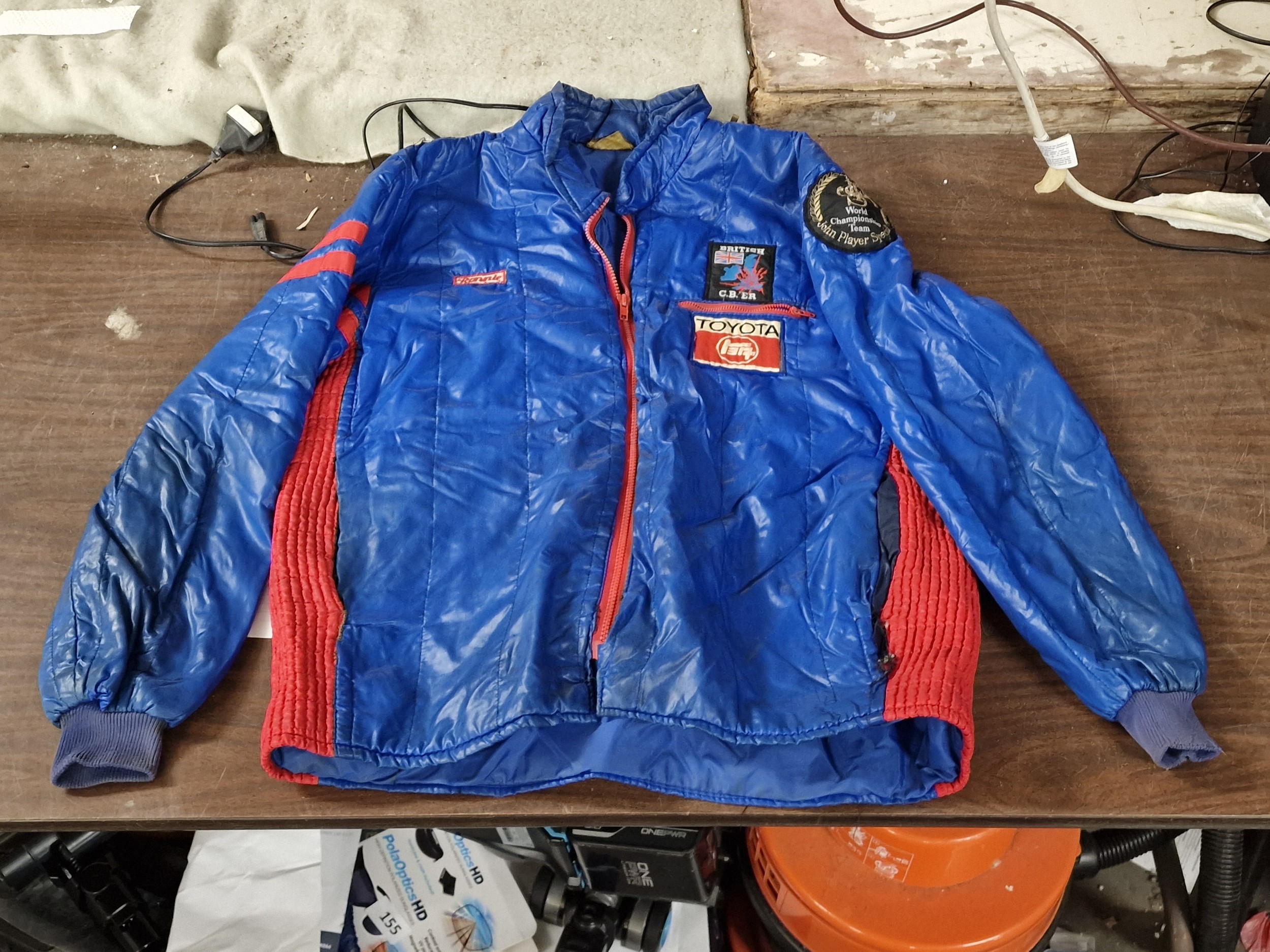 Vintage bomber jacket with motor racing badges attached