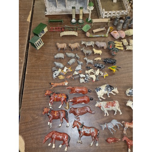 284 - Good job lot of mostly Britains farm animals, figures, buildings and other items, some with damage