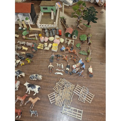 284 - Good job lot of mostly Britains farm animals, figures, buildings and other items, some with damage