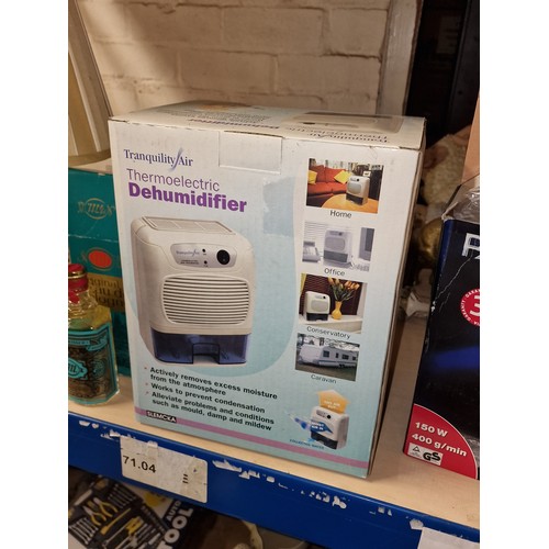 33 - Boxed and unused portable thermoelectric dehumidifier