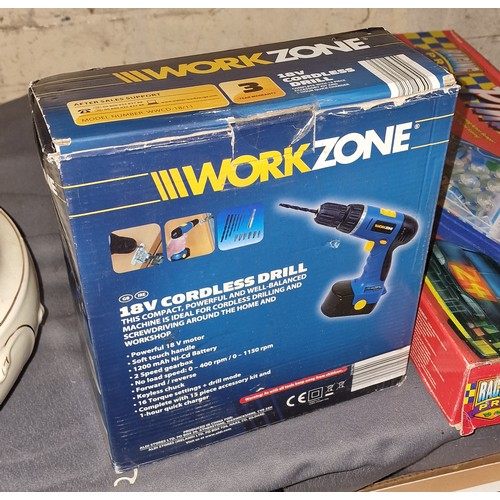 58 - Boxed and unused Workzone 18 volt cordless drill with charger and accessory kit