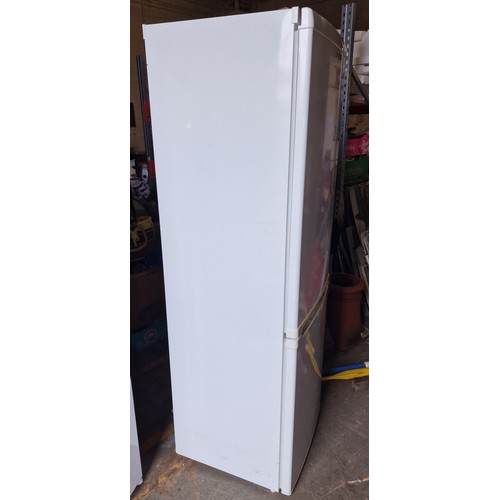 292 - 60 cm wide and 185 cm tall white Logik 60/40 fridge freezer