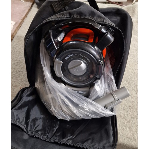 284 - Black and Decker 12 volt Dust Buster in bag