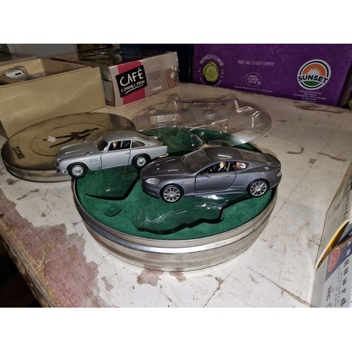 144 - Corgi James Bond collection Aston Martin DB5 & DBS twin set in film reel tin