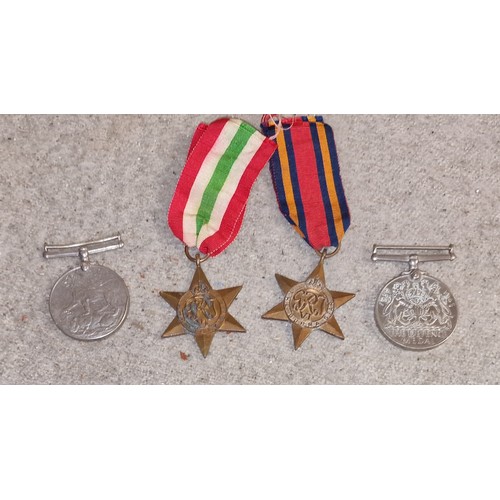 47 - Bundle of 4 x WWII medals being Burma & Italy stars with ribbons and defence and victory medals with... 