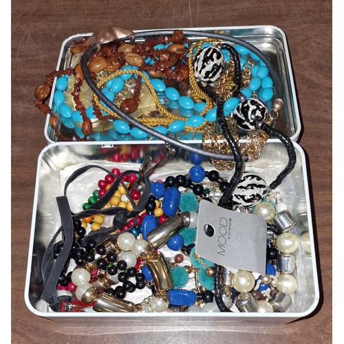 41 - Tin of assorted costume/fashion jewellery