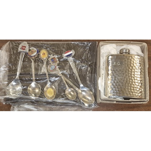 143 - Boxed hammered pewter pocket flask and carded bundle of 6 x souvenir spoons