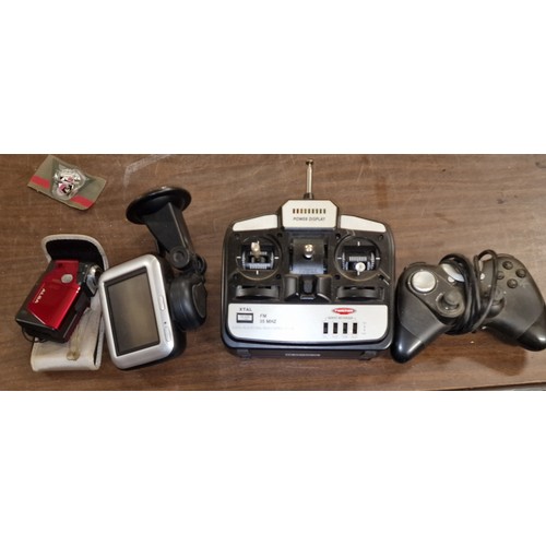 15 - Alba camcorder, Tom Tom sat nav, radio controller and gaming controller bundle