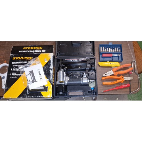 16 - Boxed and unused Tooltech pneumatic nail and staple gun and a few other loose hand tools