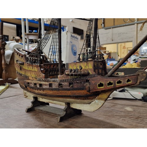 166 - Approx 2 ft long and tall wooden model galleon - 1 mast broken but present