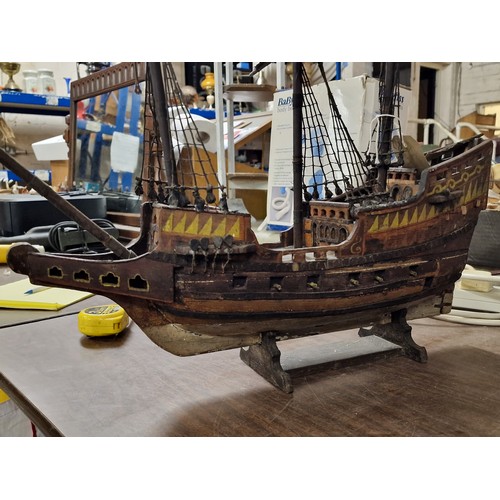 166 - Approx 2 ft long and tall wooden model galleon - 1 mast broken but present