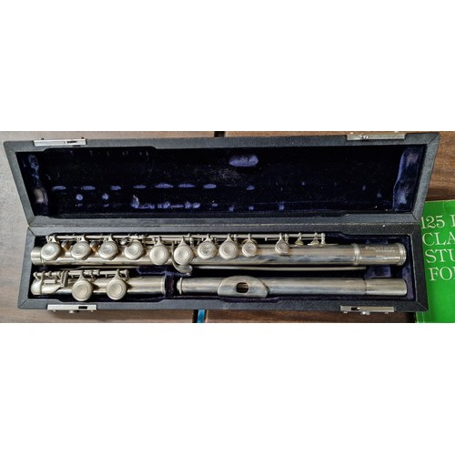 92 - Flute in case, Sapphire by Rossetti London, with sheet music stand and books - initialled GSL