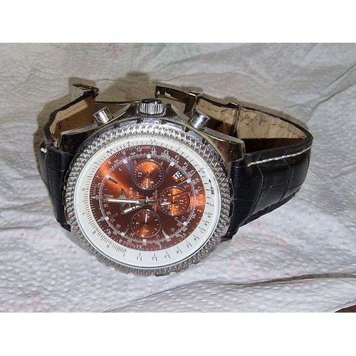 64 - Gents designer style watch with red face