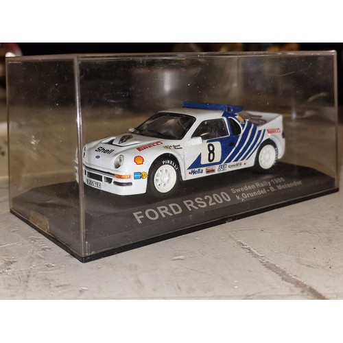 114 - Ford RS 200 1/43 rally car, as new in perspex case