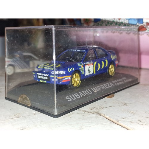 115 - Subaru Impreza 1/43 rally car, as new in perspex case