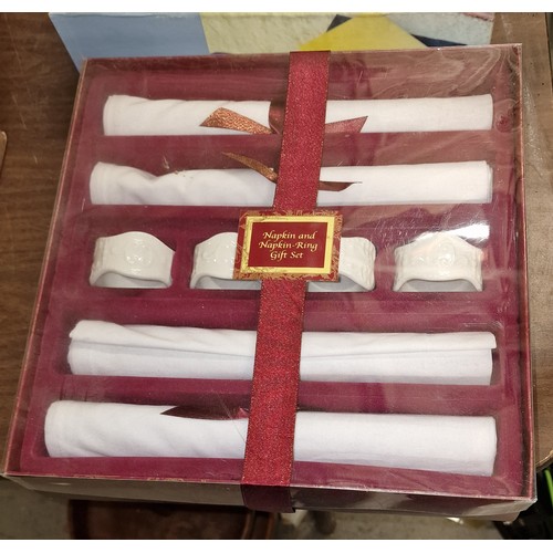 198 - Boxed and unused retro ceramic napkin ring and cotton napkin set