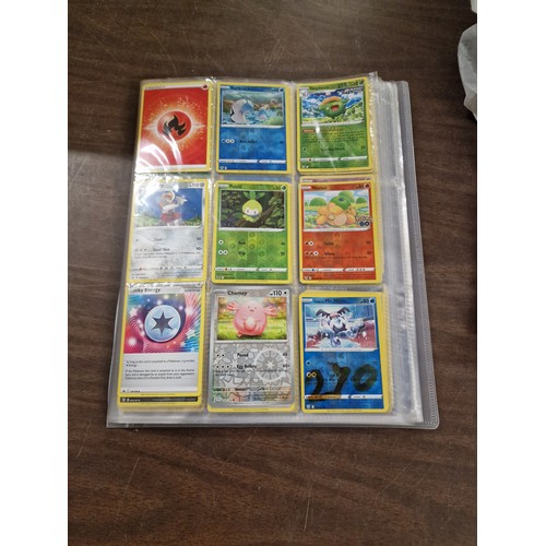 36 - Folder containing 270 assorted Pokemon trading cards - to view all cards copy and paste https://1drv... 