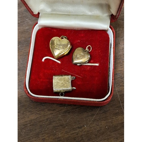 79 - Rolled gold and 9 ct back and front love heart locket pendants and other unstamped yellow metal lock... 