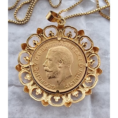 63 - 1911 full sovereign gold coin in ornate 9 ct pendant mount and on 9 ct chain - 13.4 gm