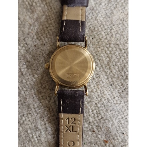 84A - YR ladies 9 ct gold cased watch in working order with leather strap