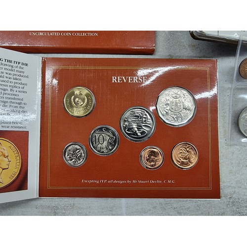 25 - 3 x coin collections being 1986 Australian mint, 1977 New Zealand and 1973 Barbados