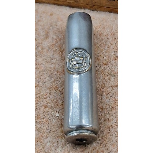 245 - 1942 Royal navy 20 mm shell case with badge attached