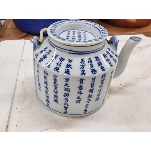 40 - Chinese small blue and white scripted tea pot