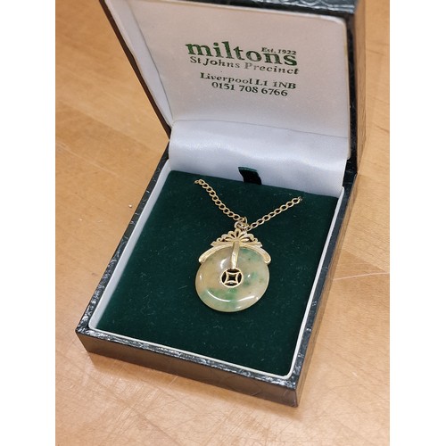 360 - 14k stamped gold and jade amulet pendant on 9 ct hallmarked gold chain