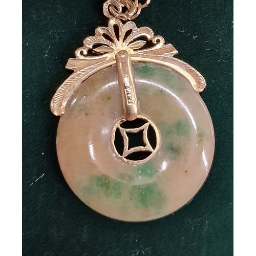 360 - 14k stamped gold and jade amulet pendant on 9 ct hallmarked gold chain