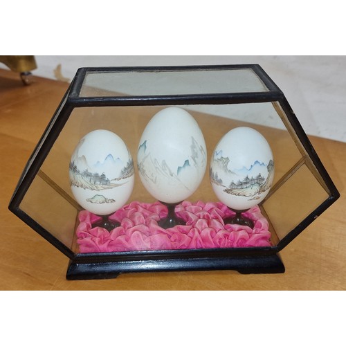 117 - Trio of hand painted Chinese eggs in 20 cm wide and 12 cm tall hexagonal display case