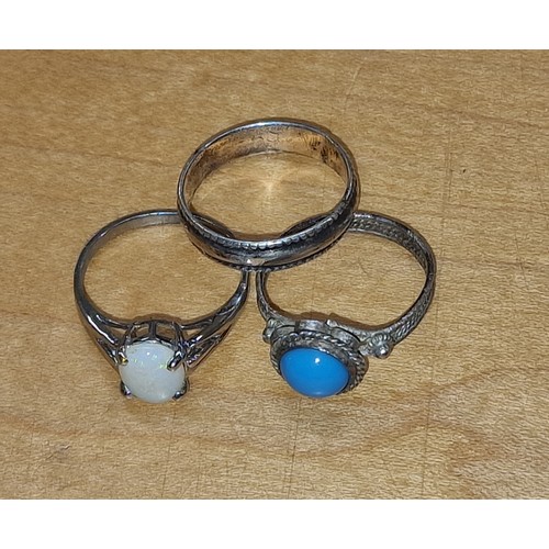 374 - 2 x 925 stamped and 1 x unstamped white metal ring with blue stone, sizes N/O/Q