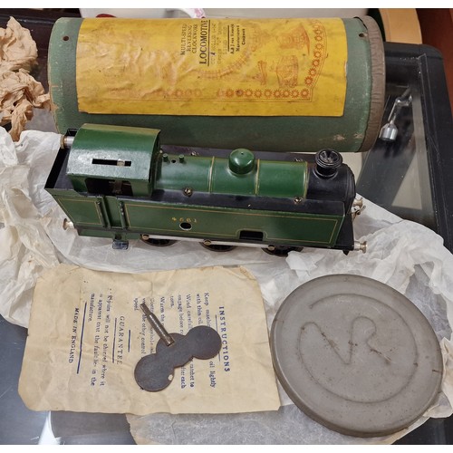 231 - Rare Walker-Riemsdyk O gauge multi speed reversing clockwork locomotive in original tube box with ke... 